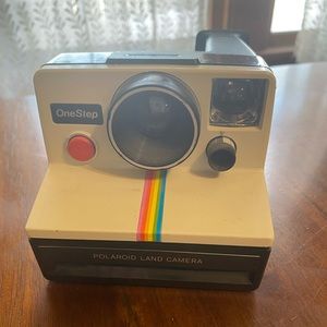 Vintage Polaroid one step land camera with rainbow stripe